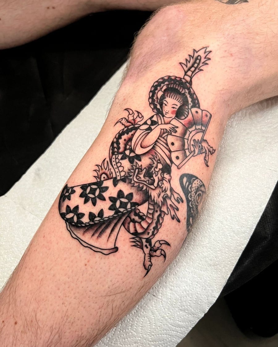 Blackwork forearm tattoo of a woman in an ornate dress holding playing cards