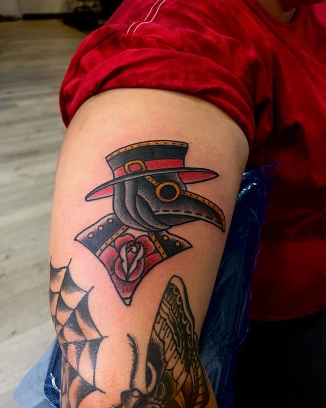 Black and grey neo-traditional plague doctor and rose tattoo by Phillip Leslie at Broken Heart Tattoo in Hillcrest, San Diego
