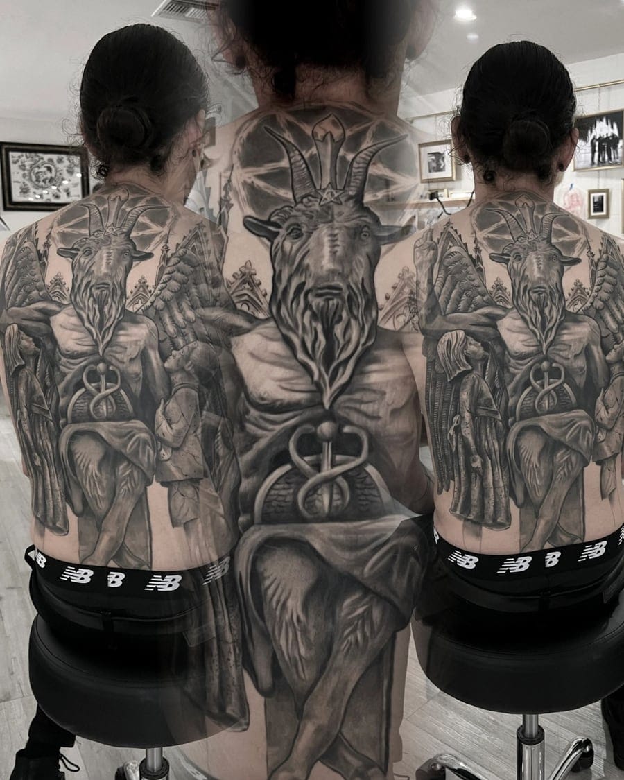 Black and grey realism tattoo sleeve with a skull and detailed shading covering a full arm