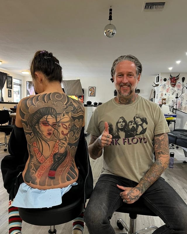 Japanese geisha and hannya mask back piece tattoo in black and grey, finished at Broken Heart Tattoo in Hillcrest, San Diego